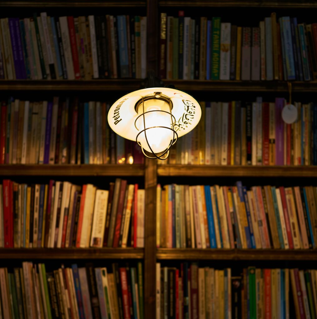 books under the light in library