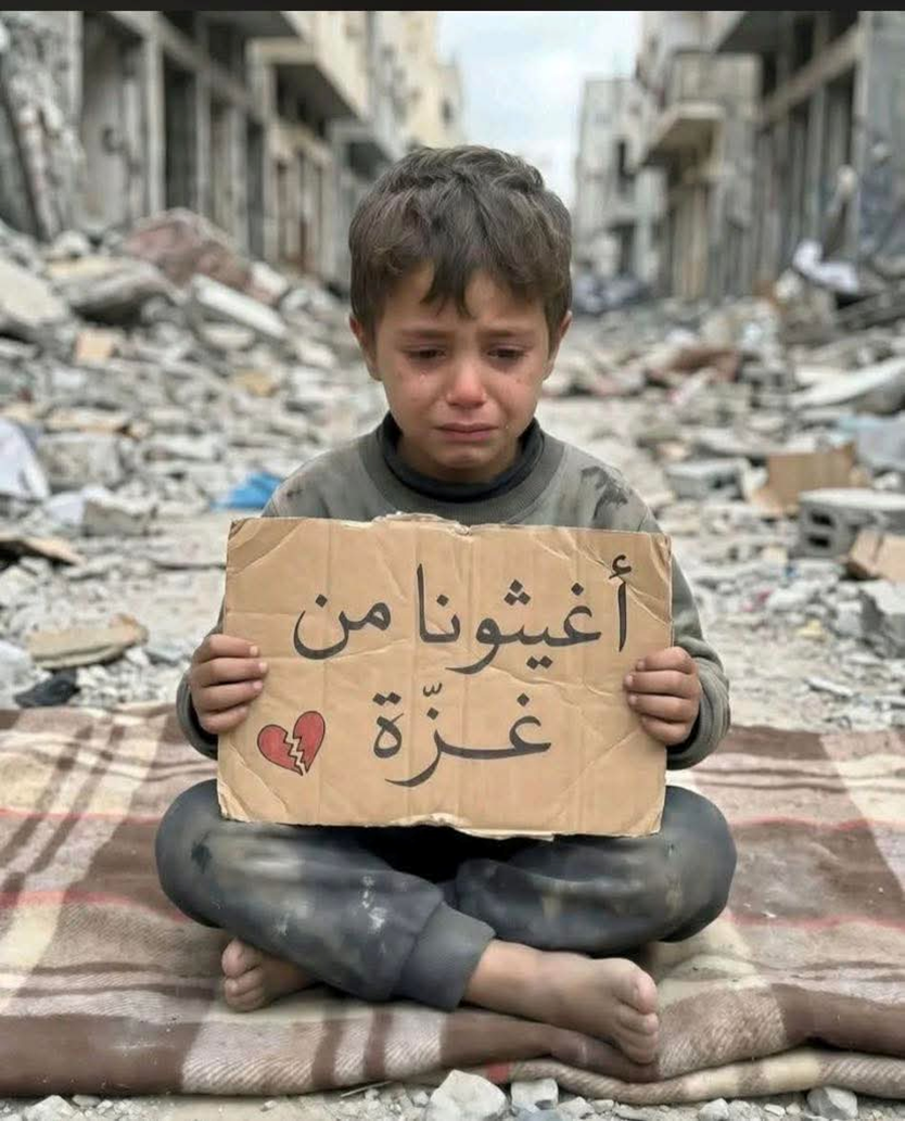 A Palestinian boy crying in the street where buildings are devastated