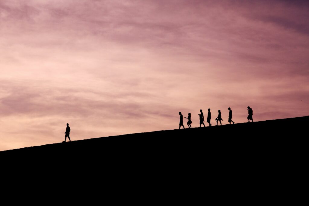 A man is walking ahead like a leader